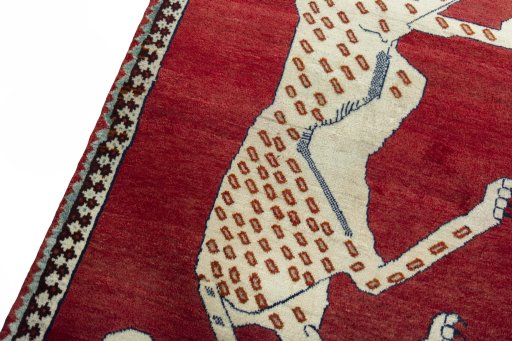 Backside of handmade 2000s Persian Gabbeh rug showing knot structure and weave density
