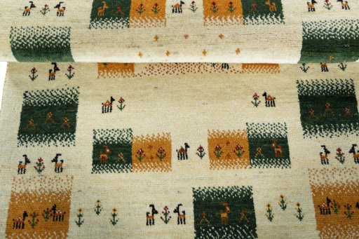 Full view of 2000s Persian Gabbeh rug from Iran / Persia, 147 × 105 cm in Beige tones