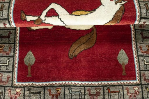 Full view of 2000s Persian Gabbeh rug from Iran / Persia, 130 × 95 cm in Red tones