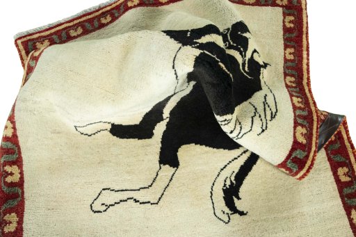 Corner detail of 2000s Persian Gabbeh rug showing border pattern and Wool pile