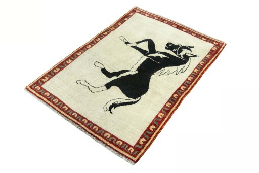 Corner detail of 2000s Persian Gabbeh rug showing border pattern and Wool pile