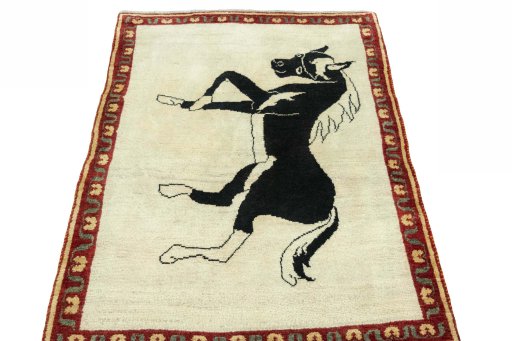 Surface texture of 2000s Persian Gabbeh rug with natural Wool and intricate pattern