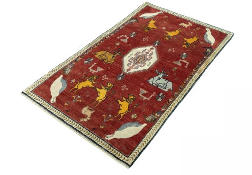 Corner detail of 2000s Persian Gabbeh rug showing border pattern and Wool pile