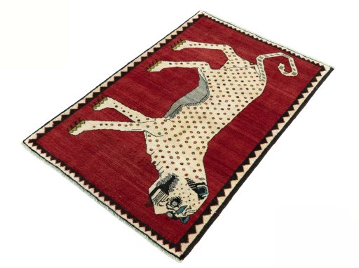 Corner detail of 2000s Persian Gabbeh rug showing border pattern and Wool pile
