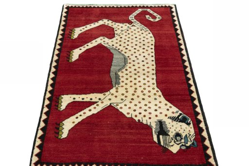 Surface texture of 2000s Persian Gabbeh rug with natural Wool and intricate pattern