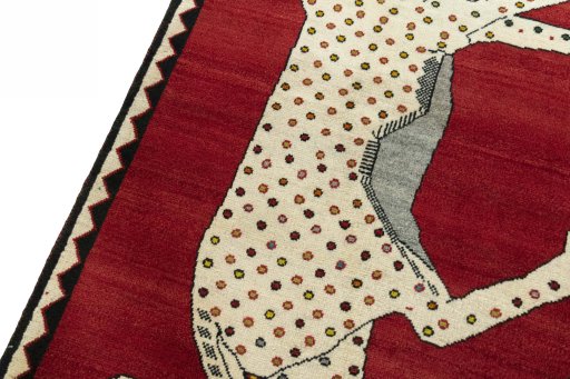 Backside of handmade 2000s Persian Gabbeh rug showing knot structure and weave density