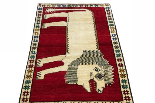 Surface texture of 2000s Persian Gabbeh rug with natural Wool and intricate pattern