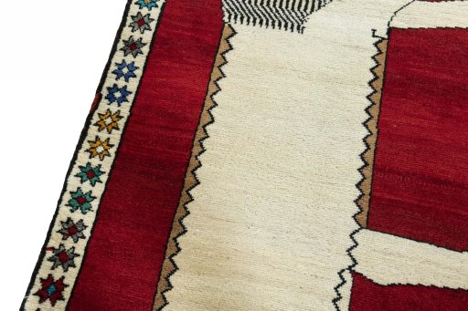 Backside of handmade 2000s Persian Gabbeh rug showing knot structure and weave density