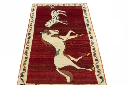 Surface texture of 2000s Persian Gabbeh rug with natural Wool and intricate pattern