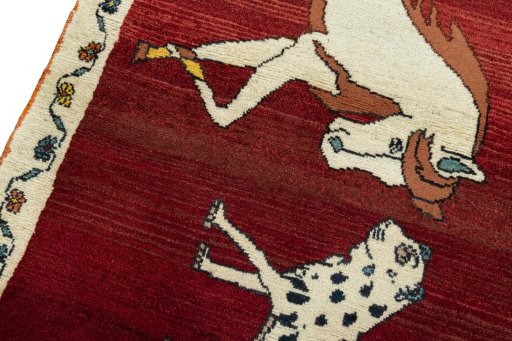 Backside of handmade 2000s Persian Gabbeh rug showing knot structure and weave density