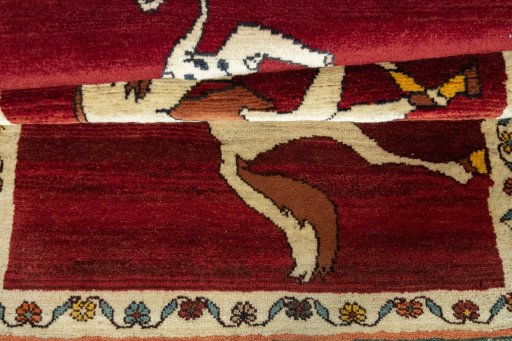Full view of 2000s Persian Gabbeh rug from Iran / Persia, 177 × 101 cm in Red tones