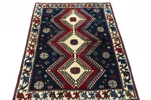 Surface texture of 2000s Persian Gabbeh rug with natural Wool and intricate pattern