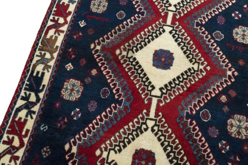 Backside of handmade 2000s Persian Gabbeh rug showing knot structure and weave density