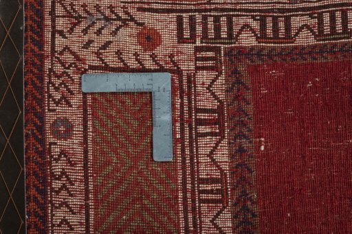 Surface texture of 2000s Persian Gabbeh rug with natural Wool and intricate pattern