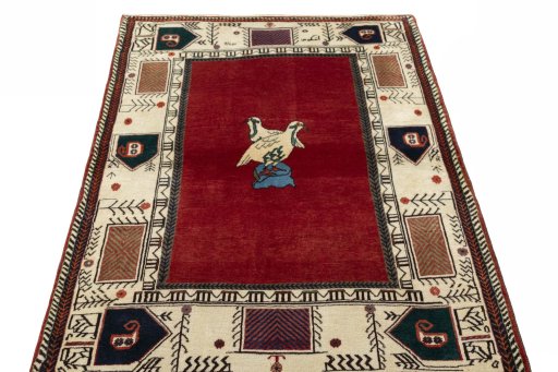 Surface texture of 2000s Persian Gabbeh rug with natural Wool and intricate pattern