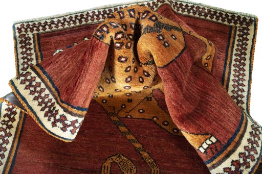 Corner detail of 1970s Persian Gabbeh rug showing border pattern and Wool pile