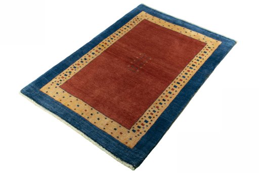 Corner detail of 2000s Persian Gabbeh rug showing border pattern and Wool pile