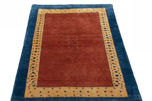 Surface texture of 2000s Persian Gabbeh rug with natural Wool and intricate pattern