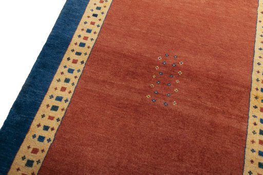 Backside of handmade 2000s Persian Gabbeh rug showing knot structure and weave density