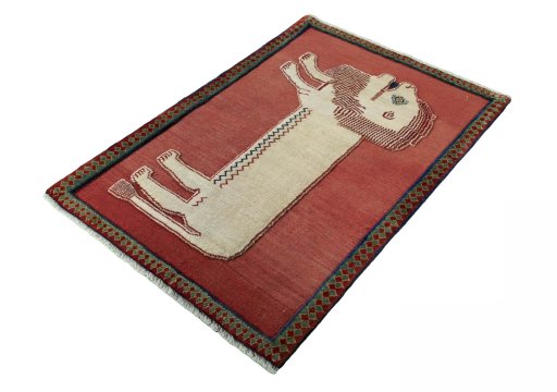 Corner detail of 2000s Persian Gabbeh rug showing border pattern and Wool pile