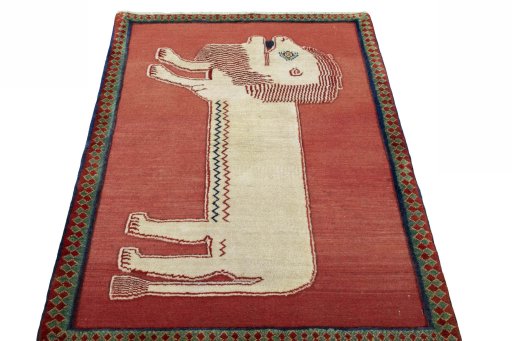 Surface texture of 2000s Persian Gabbeh rug with natural Wool and intricate pattern