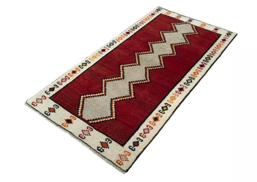 Corner detail of 2000s Persian Gabbeh rug showing border pattern and Wool pile