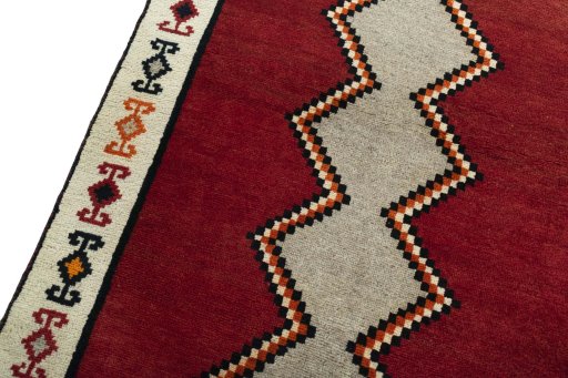 Backside of handmade 2000s Persian Gabbeh rug showing knot structure and weave density
