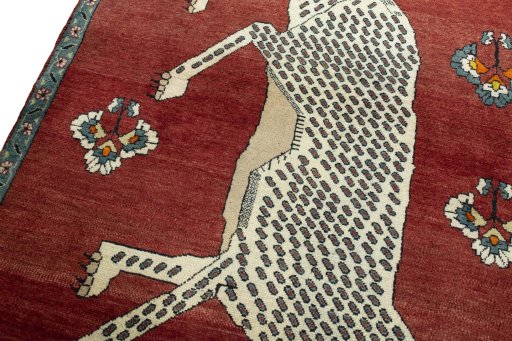 Backside of handmade 2000s Persian Gabbeh rug showing knot structure and weave density
