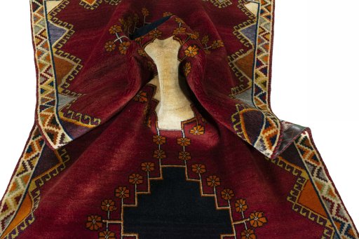 Corner detail of 2000s Persian Gabbeh rug showing border pattern and Wool pile