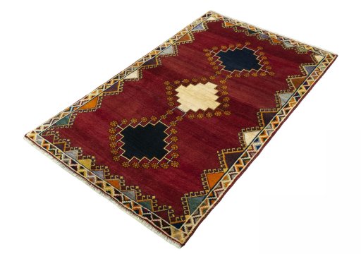 Corner detail of 2000s Persian Gabbeh rug showing border pattern and Wool pile