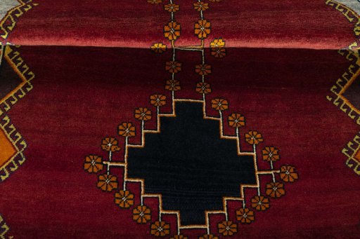 Full view of 2000s Persian Gabbeh rug from Iran / Persia, 194 × 120 cm in Red tones