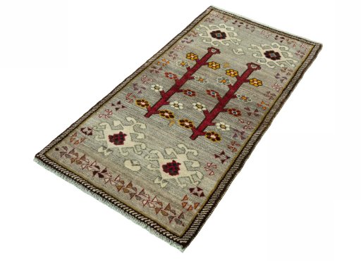 Corner detail of 2000s Persian Gabbeh rug showing border pattern and Wool pile