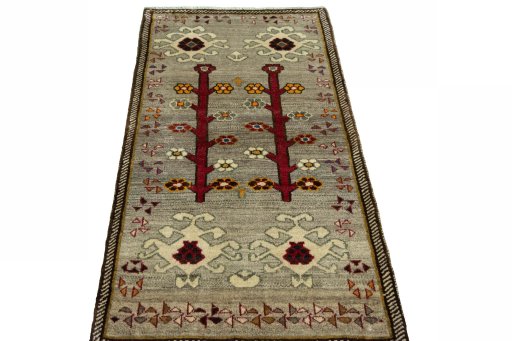 Surface texture of 2000s Persian Gabbeh rug with natural Wool and intricate pattern