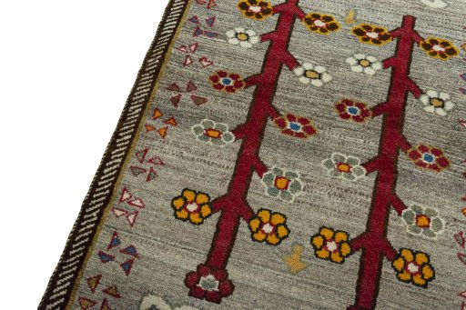 Backside of handmade 2000s Persian Gabbeh rug showing knot structure and weave density
