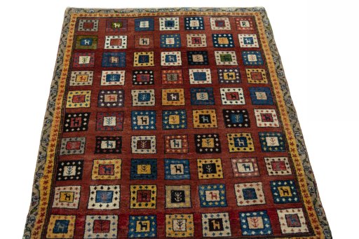 Surface texture of 2000s Persian Gabbeh rug with natural Wool and intricate pattern
