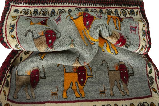 Corner detail of 2000s Persian Gabbeh rug showing border pattern and Wool pile