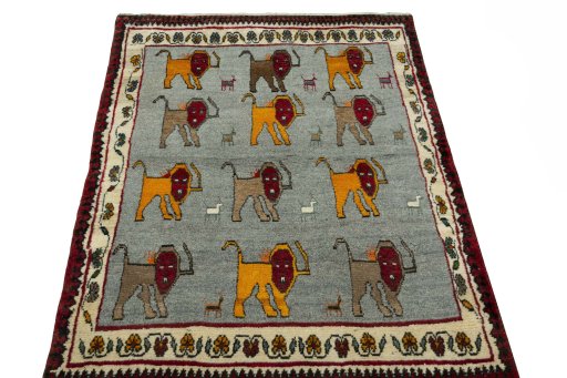 Surface texture of 2000s Persian Gabbeh rug with natural Wool and intricate pattern