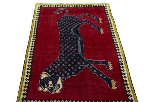 Surface texture of 2000s Persian Gabbeh rug with natural Wool and intricate pattern