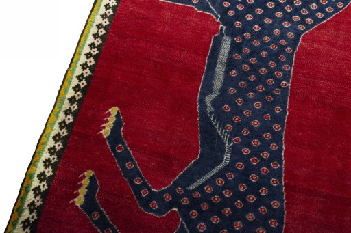 Backside of handmade 2000s Persian Gabbeh rug showing knot structure and weave density