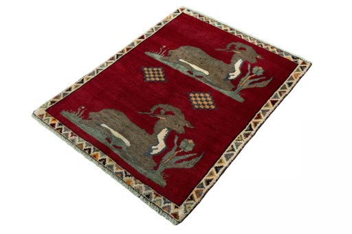 Corner detail of 2000s Persian Gabbeh rug showing border pattern and Wool pile