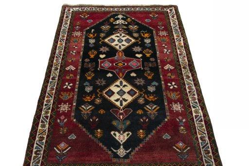 Surface texture of 2000s Persian Gabbeh rug with natural Wool and intricate pattern