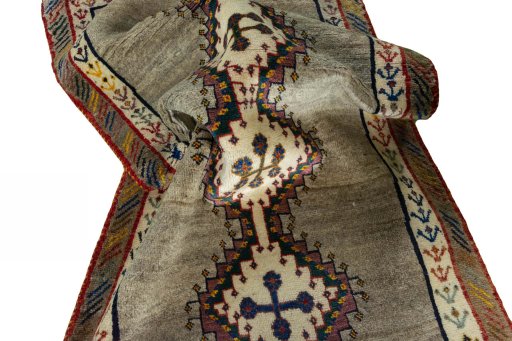 Corner detail of 2000s Persian Gabbeh rug showing border pattern and Wool pile