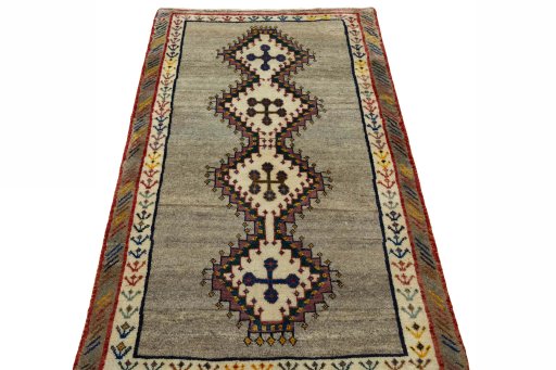 Surface texture of 2000s Persian Gabbeh rug with natural Wool and intricate pattern