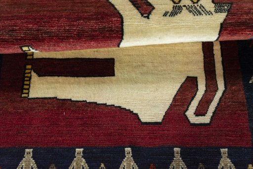 Full view of 2000s Persian Gabbeh rug from Iran / Persia, 145 × 105 cm in Red tones