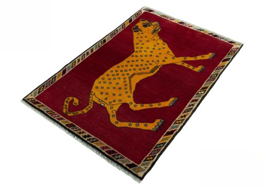 Corner detail of 2000s Persian Gabbeh rug showing border pattern and Wool pile