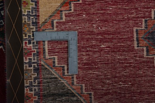 Corner detail of 2000s Persian Gabbeh rug showing border pattern and Wool pile