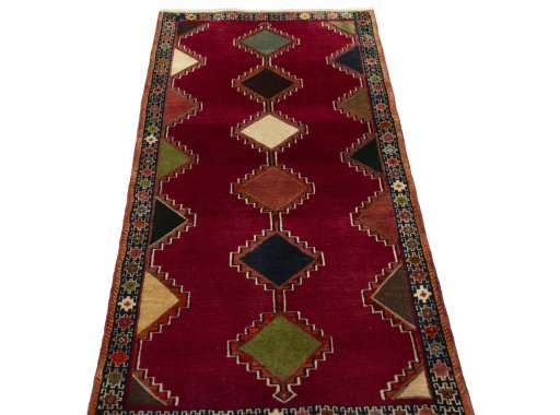Surface texture of 2000s Persian Gabbeh rug with natural Wool and intricate pattern