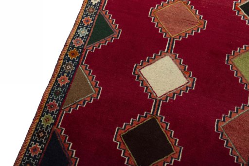 Backside of handmade 2000s Persian Gabbeh rug showing knot structure and weave density