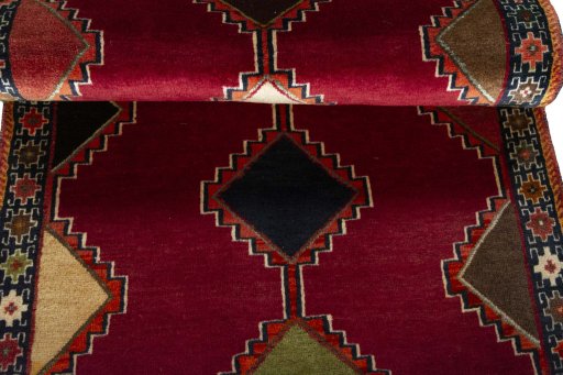 Full view of 2000s Persian Gabbeh rug from Iran / Persia, 184 × 85 cm in Red tones