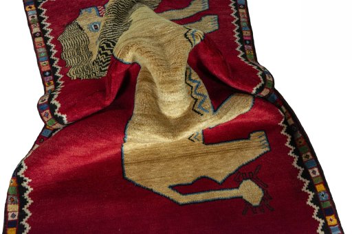 Corner detail of 2000s Persian Gabbeh rug showing border pattern and Wool pile